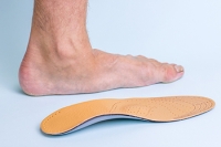How Custom-Made Orthotics Can Help With Flat Feet